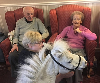 Blondie with 2 care home residents