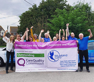 Bluebird Care Mid Essex celebrating their Outstanding review