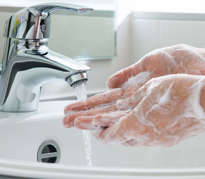 Nurse washing hands to prevent infection control