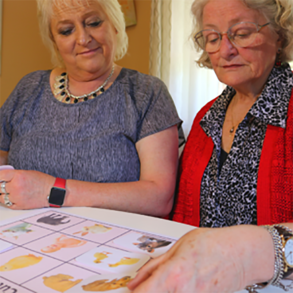 carer and patient doing dementia puzzles 